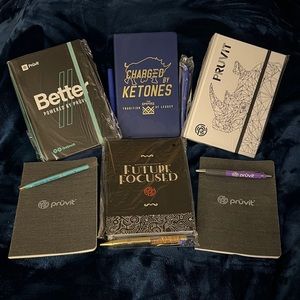 Pruvit Assortment of notebooks and pens
